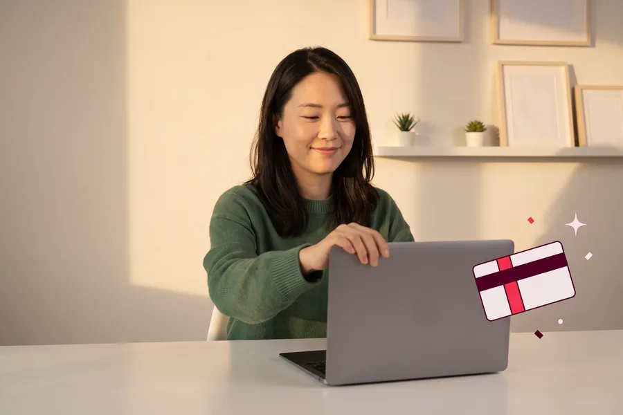 Woman closing her laptop at a home desk after a remote usability session