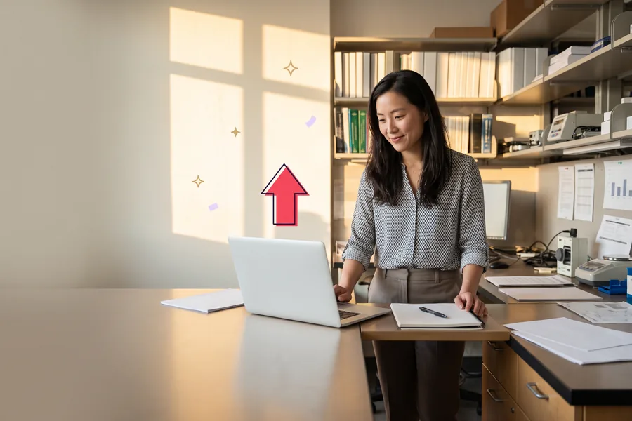 Researcher at her desk just after a session, laptop and notebook open